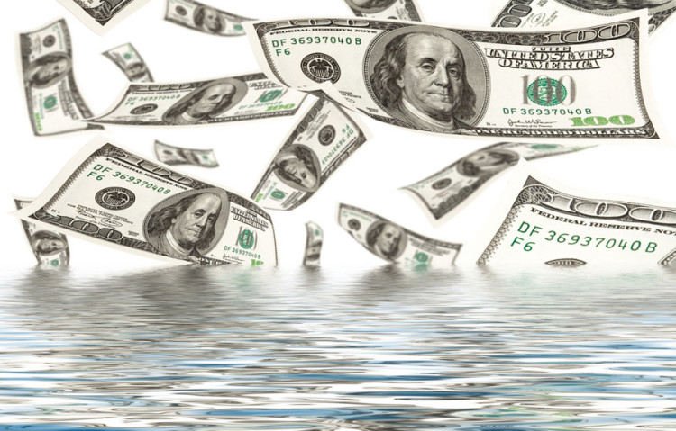 dollars floating on water