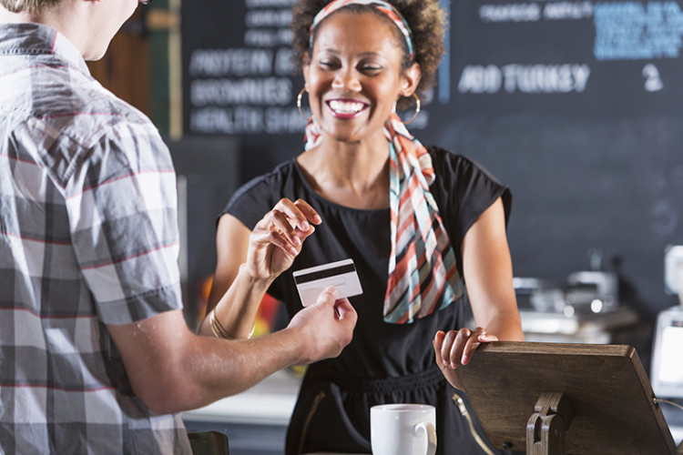 Business woman taking credit card